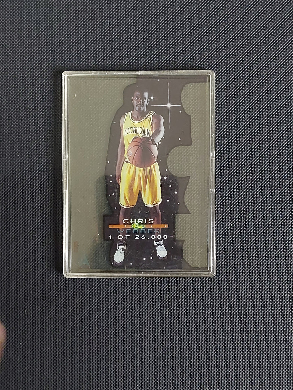1993 Classic Draft Picks Chris Webber Acetate rookie card limited to 1 of 26,000 featuring Webber in his Michigan Wolverines uniform.