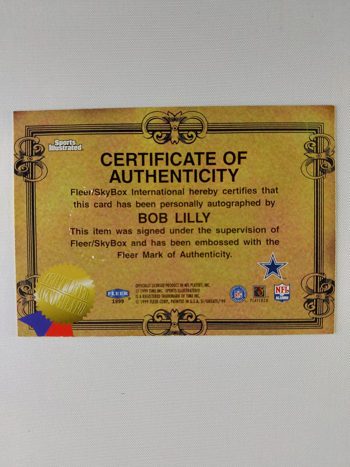 Back of 1999 Fleer Sports Illustrated Bob Lilly Autograph Collection card showing the Fleer SkyBox Certificate of Authenticity.