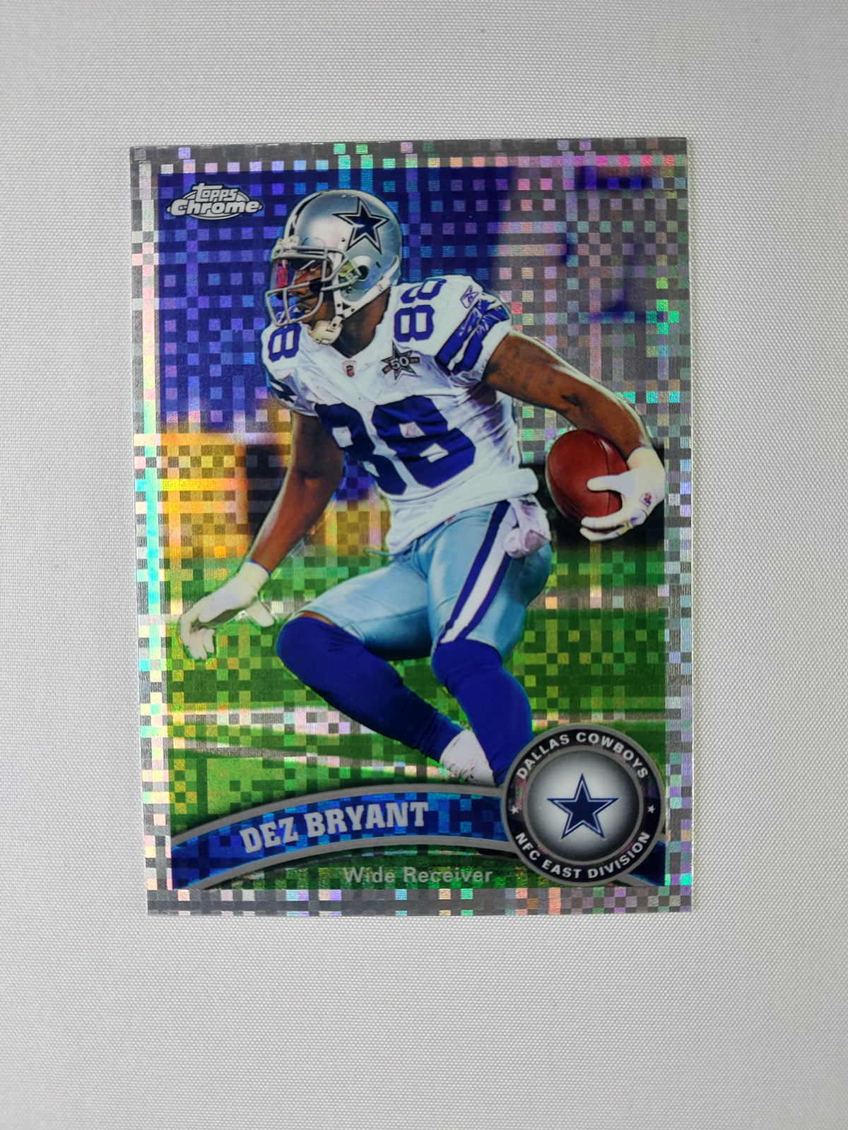 Front of 2011 Topps Chrome Dez Bryant #91 Refractor featuring the Dallas Cowboys wide receiver and rainbow Chrome finish.