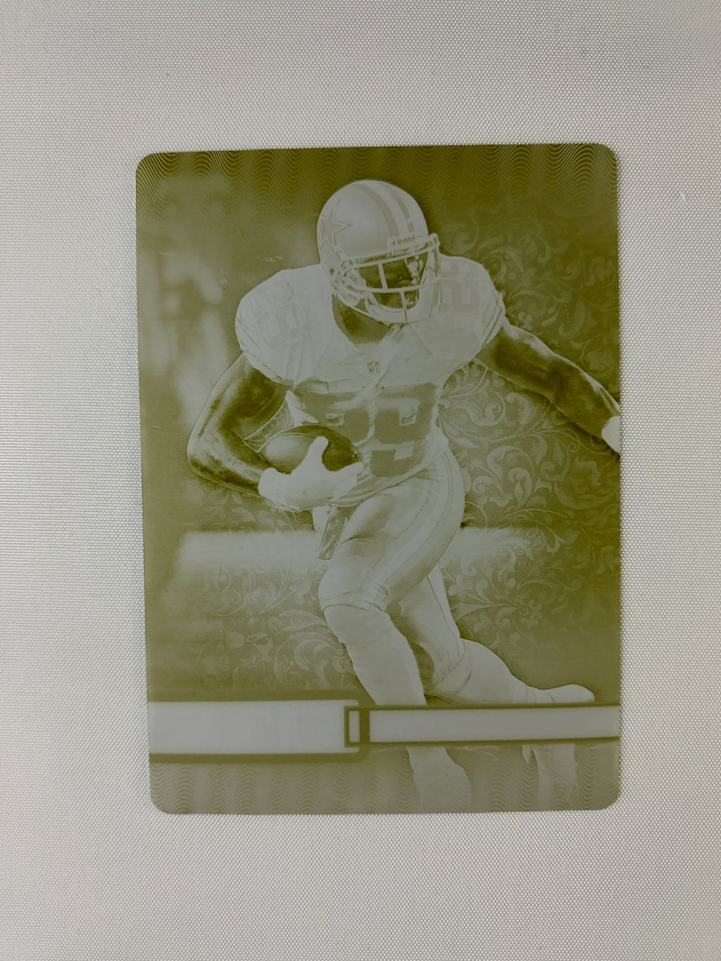 Front of the 2014 Topps Triple Threads DeMarco Murray #31 Yellow Printing Plate 1/1 featuring the Dallas Cowboys running back.