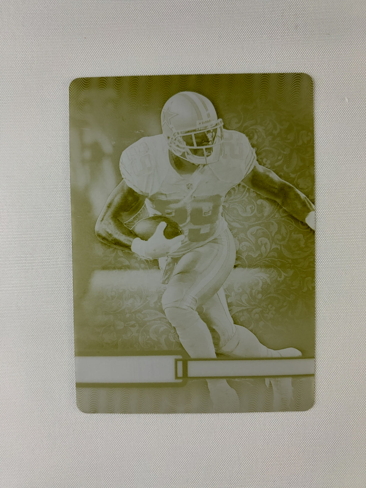 Front of the 2014 Topps Triple Threads DeMarco Murray #31 Yellow Printing Plate 1/1 featuring the Dallas Cowboys running back.