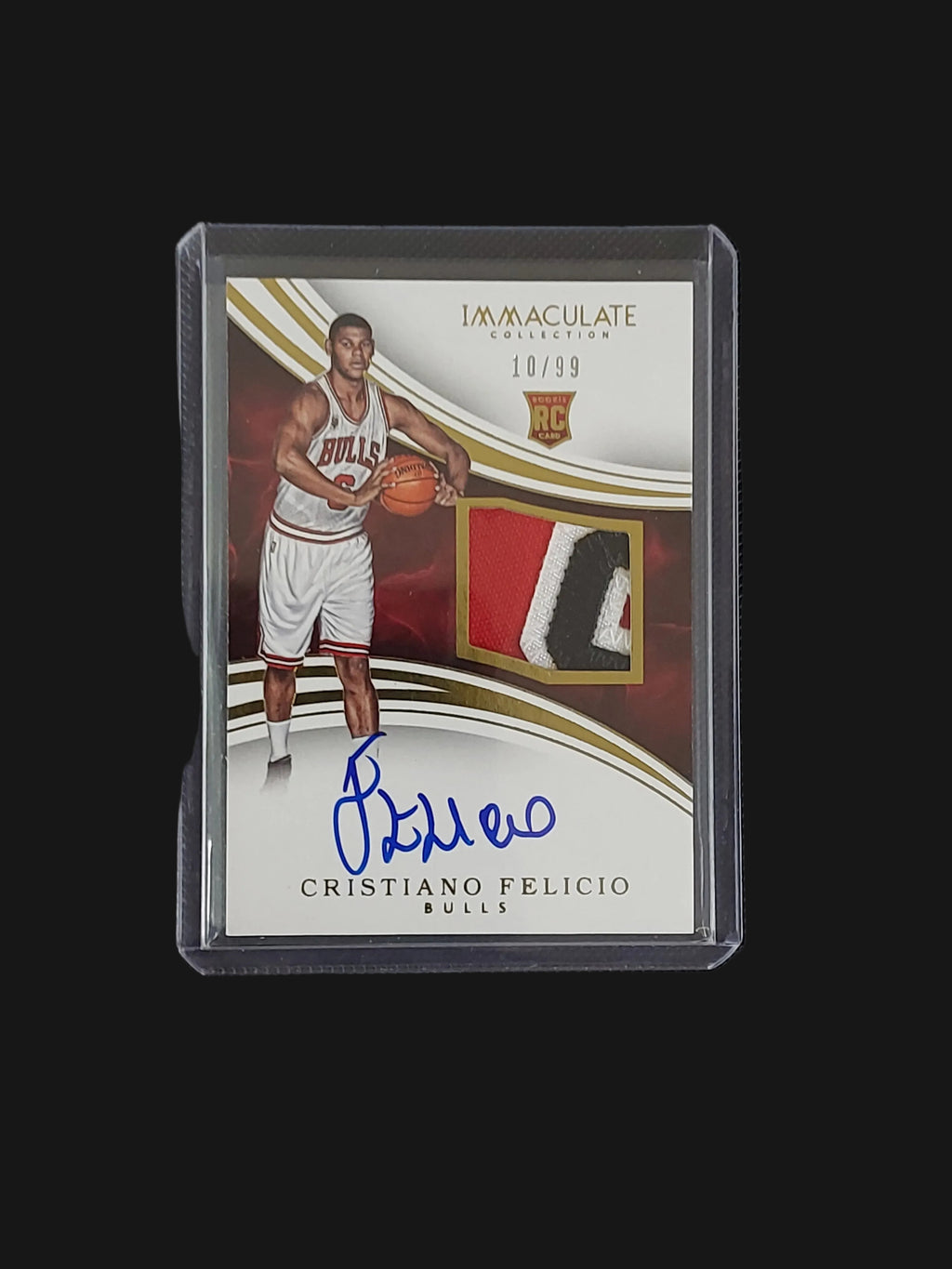 Front of 2015-16 Panini Immaculate Cristiano Felicio Rookie Patch Autograph #113 numbered 10/99 with Chicago Bulls memorabilia swatch and autograph.