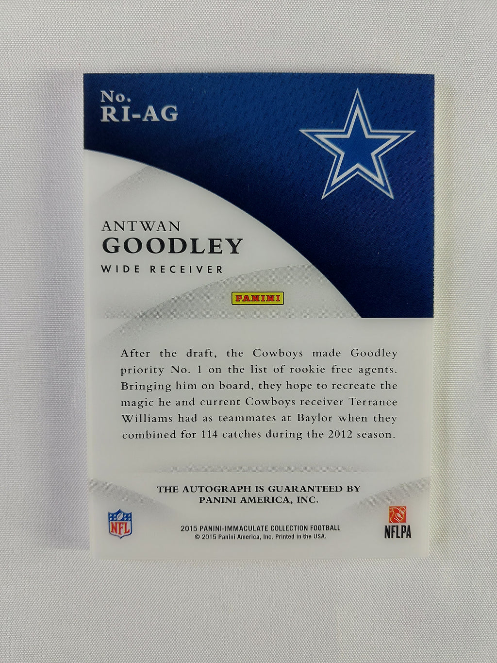 Back of 2015 Panini Immaculate Antwan Goodley Rookie Ink Gold #RI-AG showing Dallas Cowboys information and Panini autograph guarantee.