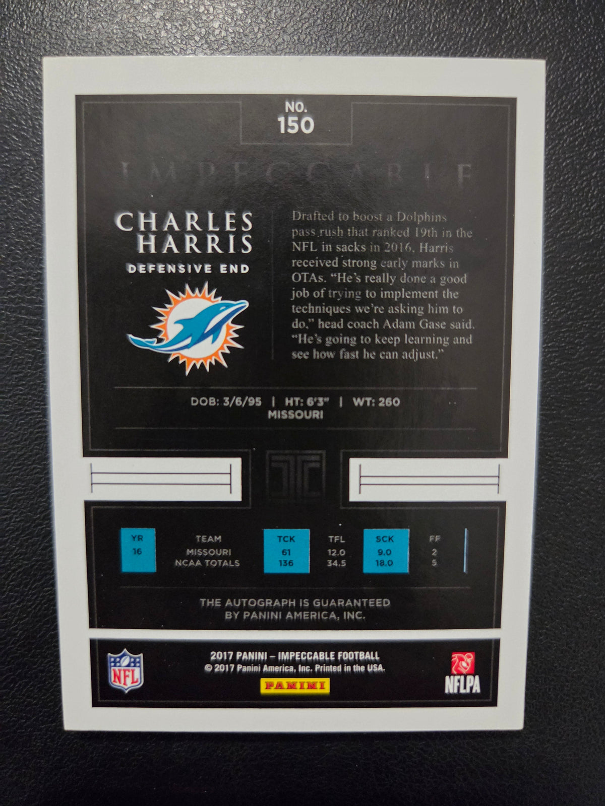 Back of 2017 Panini Impeccable Charles Harris #150 rookie autograph numbered 73/75 showing Miami Dolphins player information and Panini autograph guarantee.