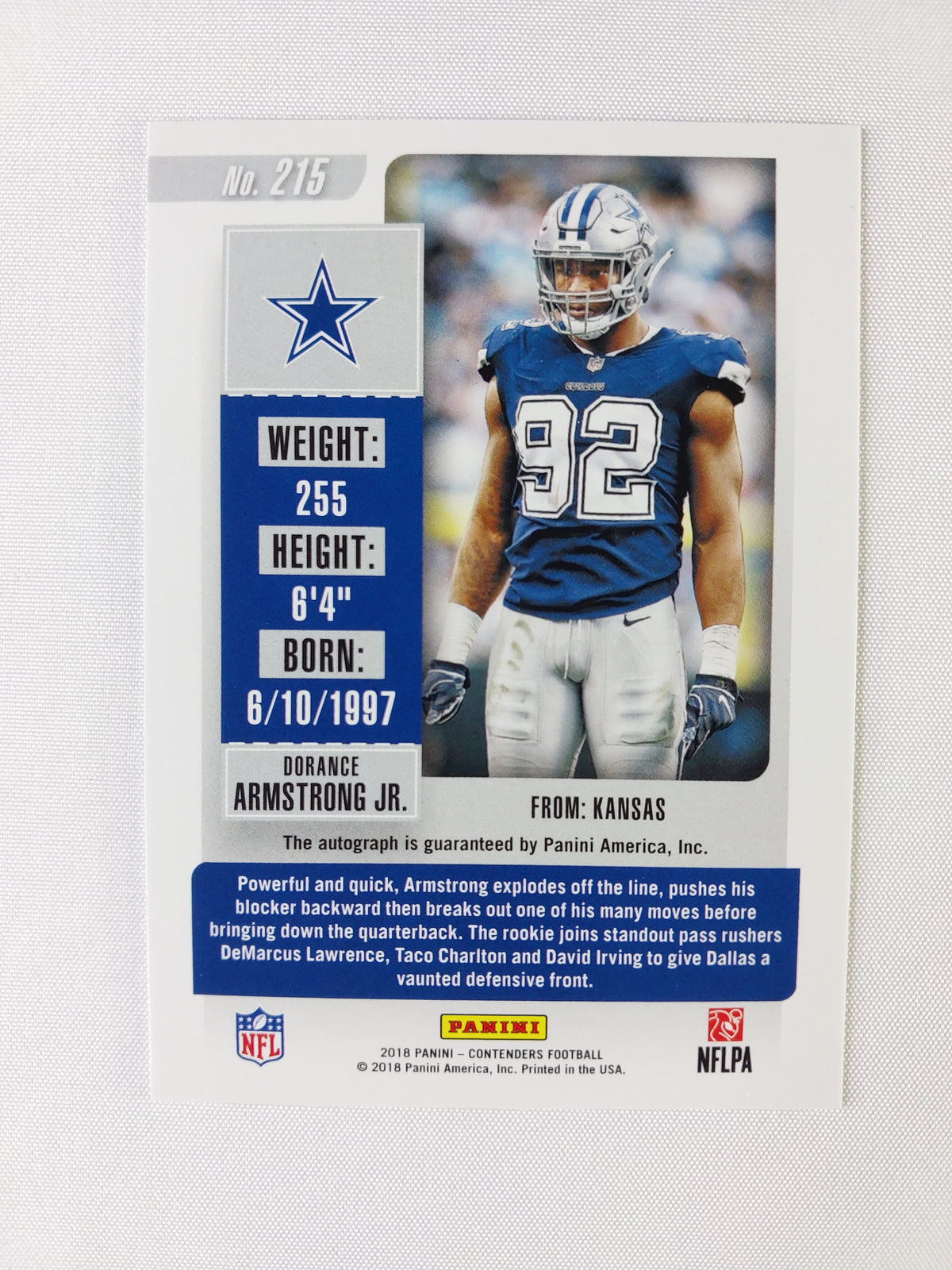 Back of 2018 Panini Contenders Dorance Armstrong Jr. Championship Ticket rookie autograph #215 showing Dallas Cowboys player information and Panini autograph guarantee.