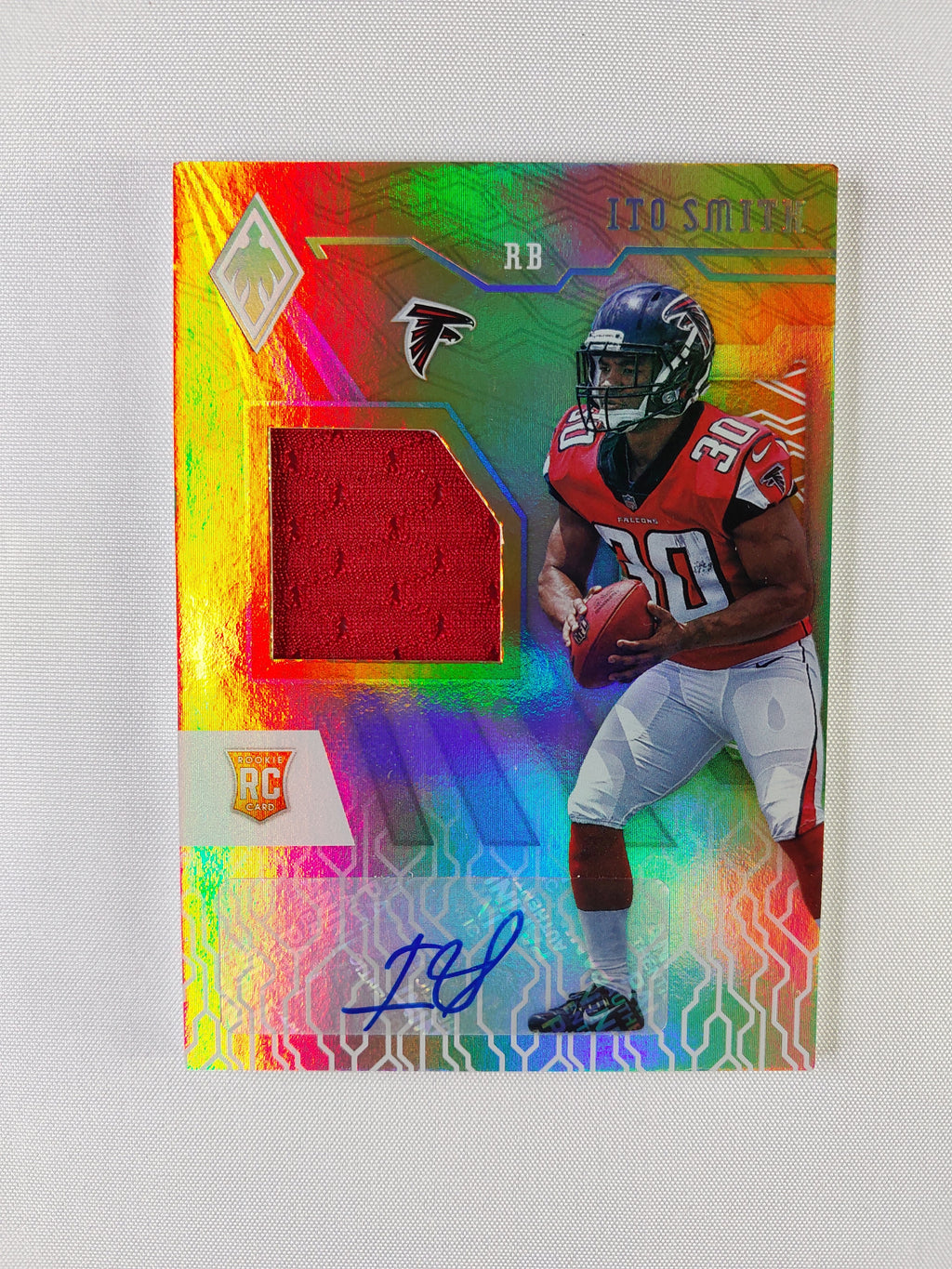 Front of 2018 Panini Phoenix Ito Smith Orange Rookie Jersey Autograph #RJA-IS featuring player-worn memorabilia and numbered 044/149.
