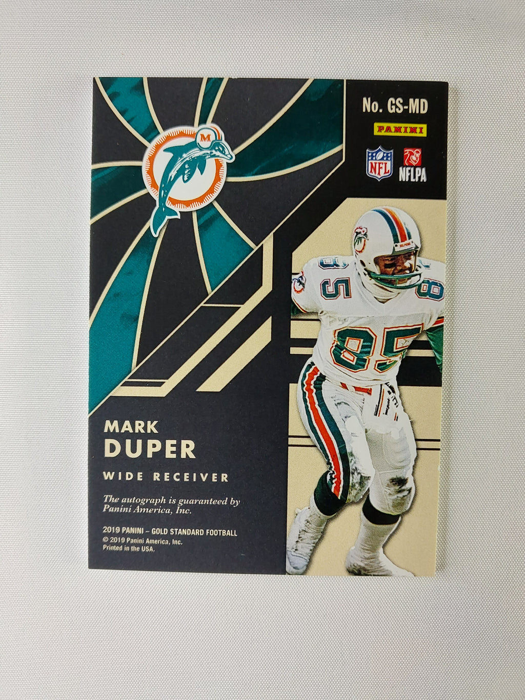 Back of 2019 Panini Gold Standard Mark Duper Gold Strike GS-MD autograph numbered 95/99 with Panini autograph authentication.