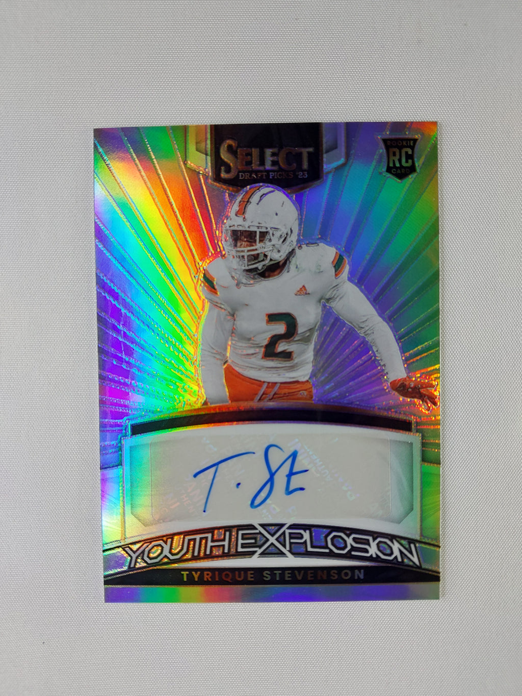 Front of 2023 Panini Select Draft Picks Tyrique Stevenson Youth Explosion Silver Prizm rookie autograph #YS-TST featuring the Miami Hurricanes defensive back.