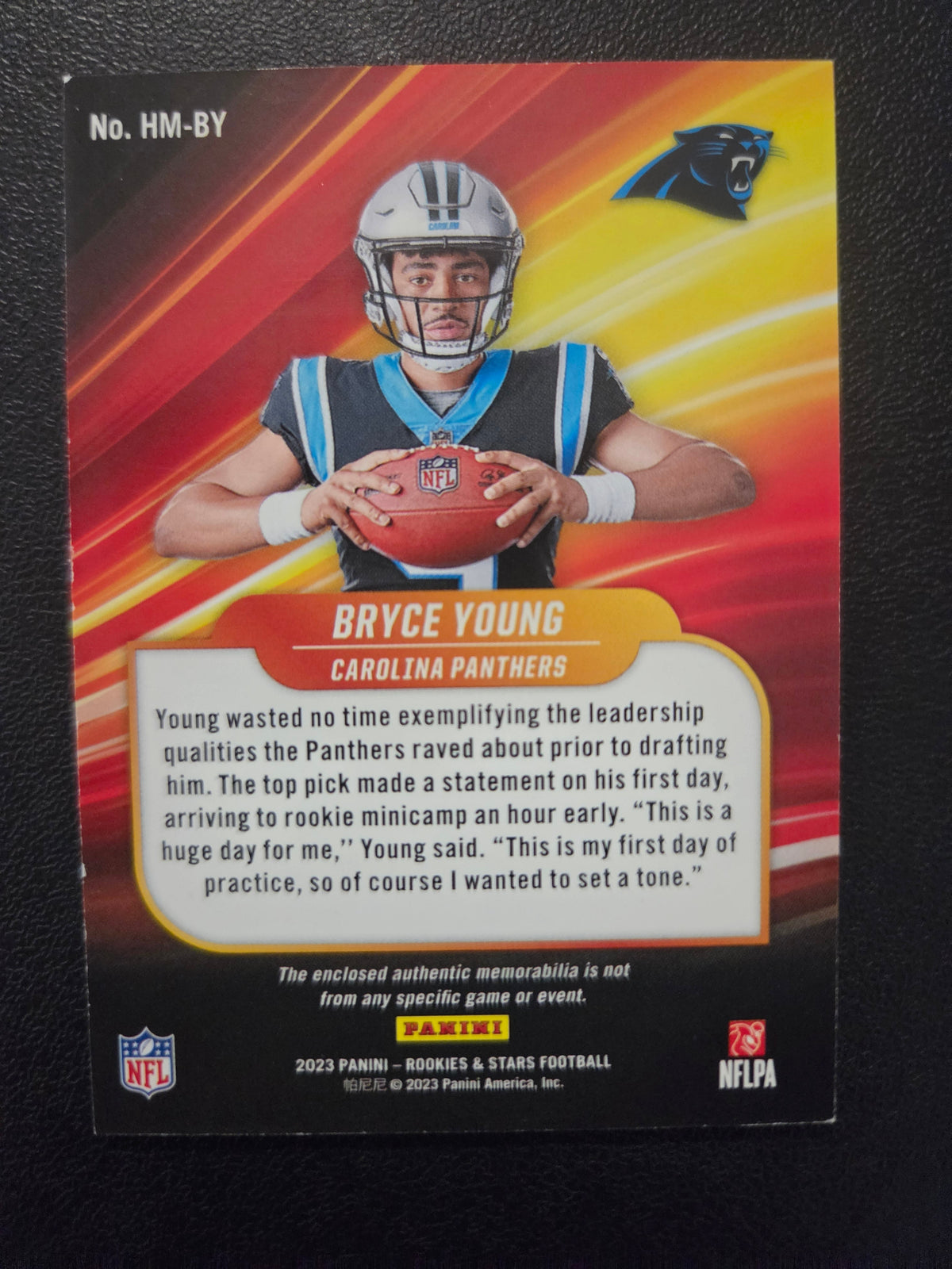 Back of 2023 Panini Rookies & Stars Bryce Young High Octane HM-BY rookie memorabilia card serial numbered 322/399 for the Carolina Panthers.