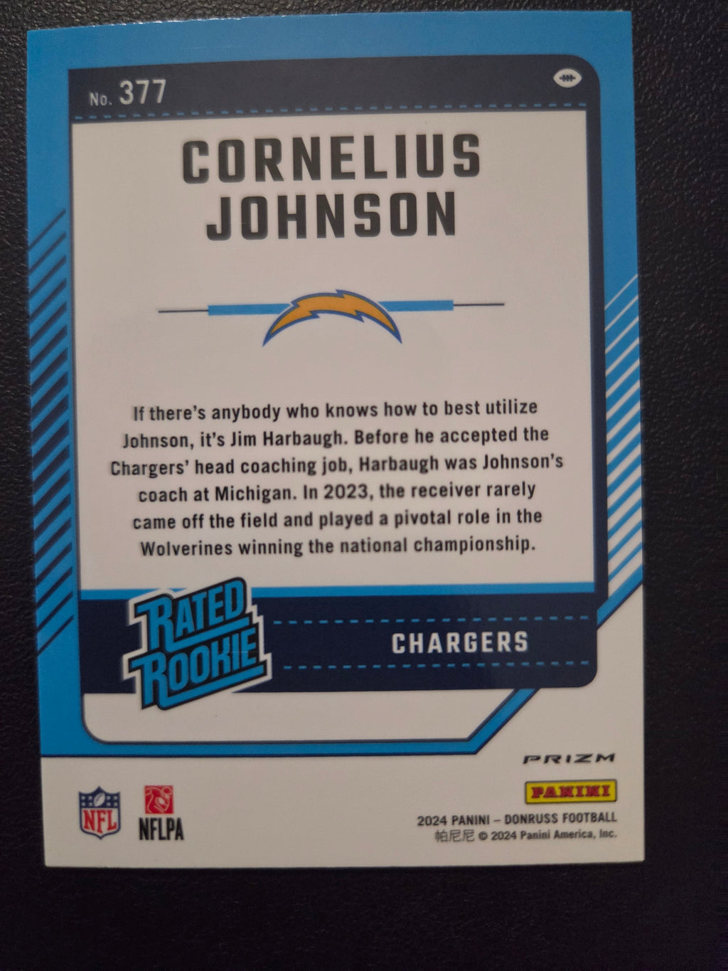 Back of 2024 Donruss Cornelius Johnson #377 Optic Rated Rookies Preview Holo card featuring Chargers and Michigan player information.
