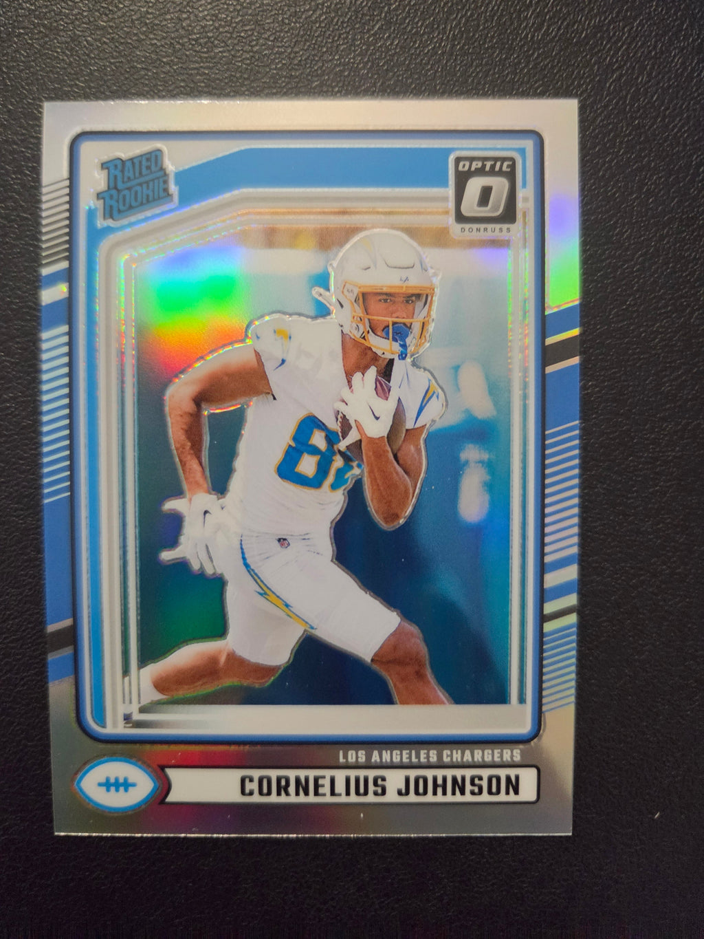 Front of 2024 Donruss Cornelius Johnson #377 Optic Rated Rookies Preview Holo card featuring the Los Angeles Chargers rookie receiver.