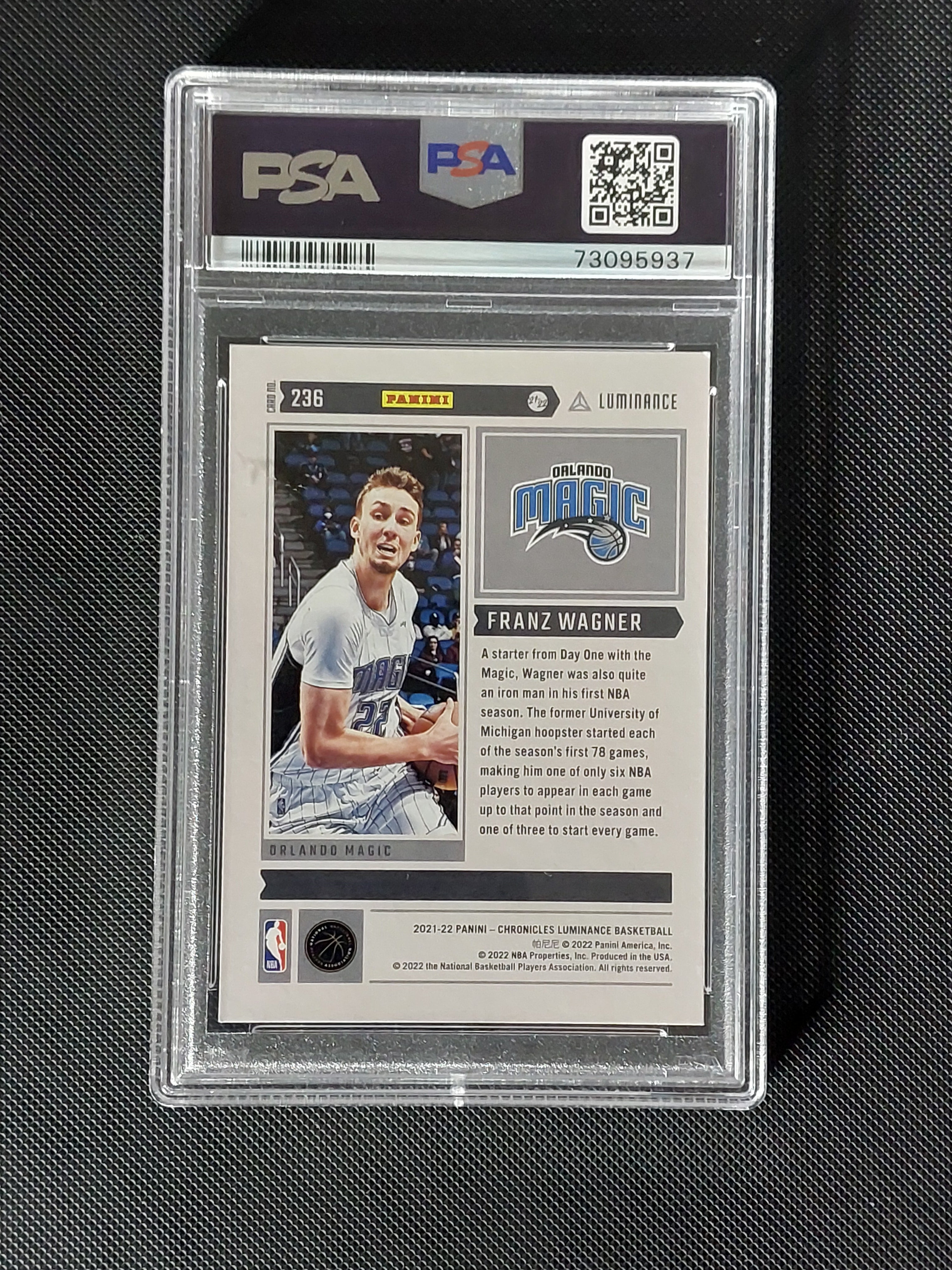 Back of 2021-22 Panini Chronicles Luminance Franz Wagner #236 Pink Rookie PSA 9 showing Orlando Magic card information.