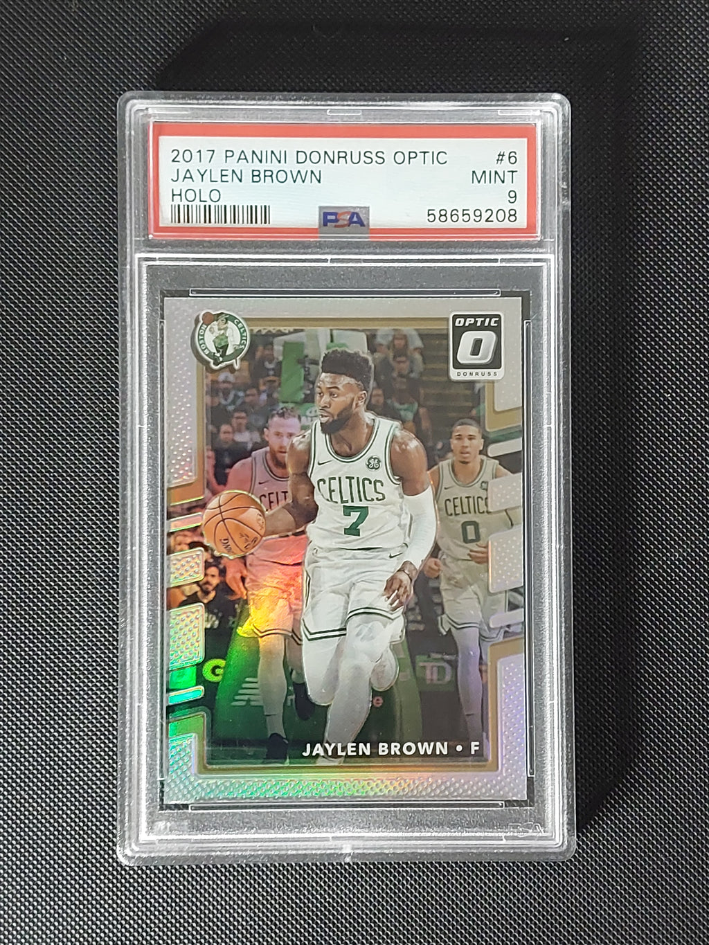 Front of 2017-18 Panini Donruss Optic Jaylen Brown #6 Holo Prizm graded PSA Mint 9