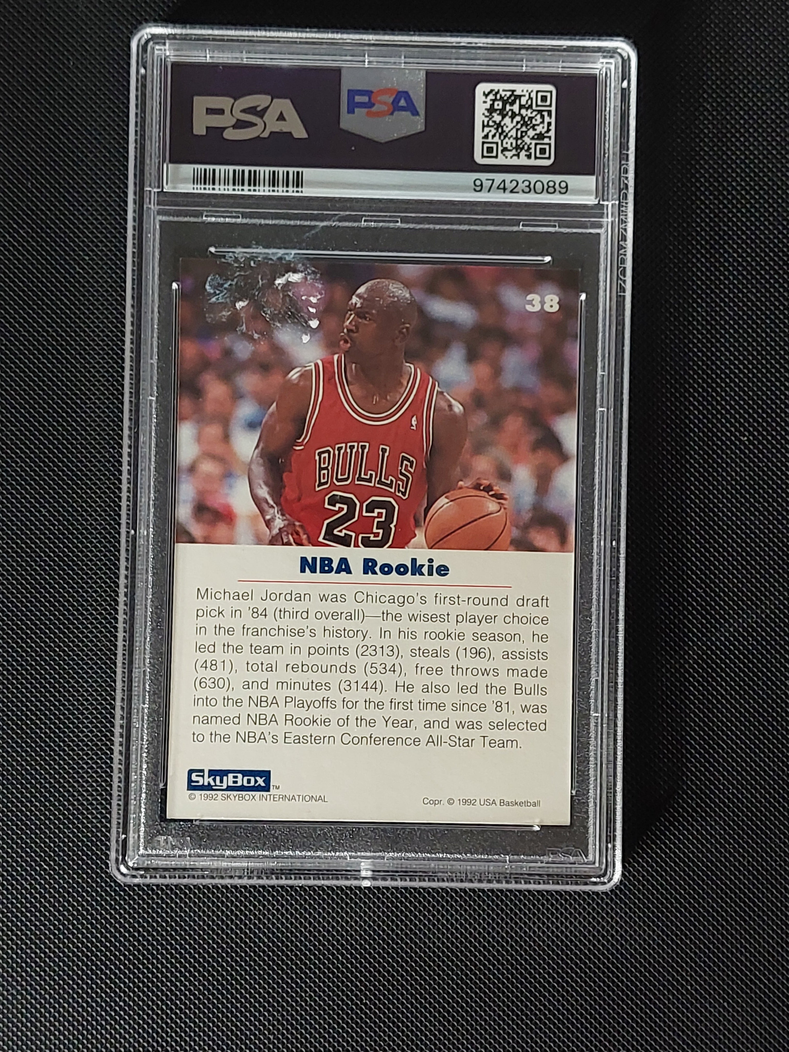 Back of 1992 SkyBox USA Basketball Michael Jordan #38 PSA Mint 9 showing NBA Rookie text and card information.