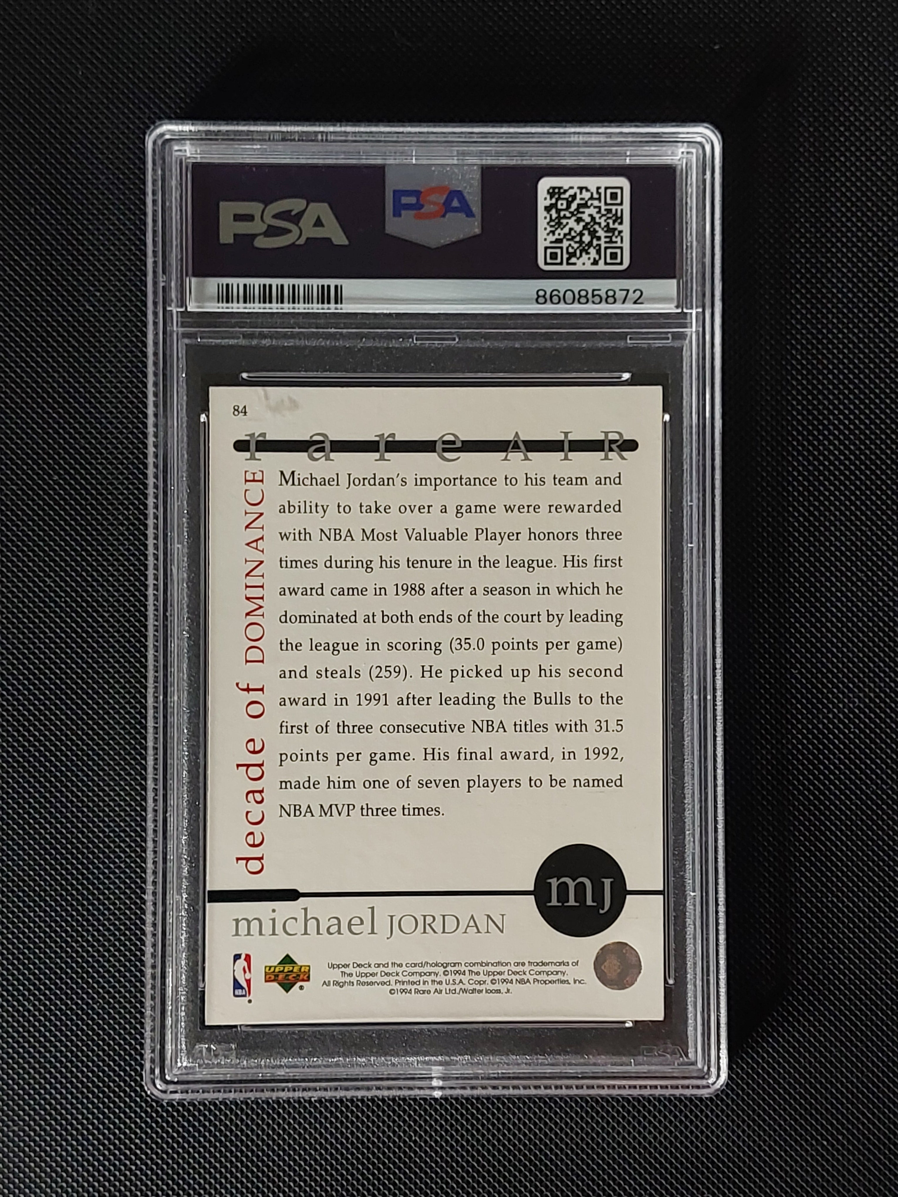 Back of 1994 Upper Deck Michael Jordan Rare Air #84 PSA 9 showing Decade of Dominance text and Michael Jordan card information.