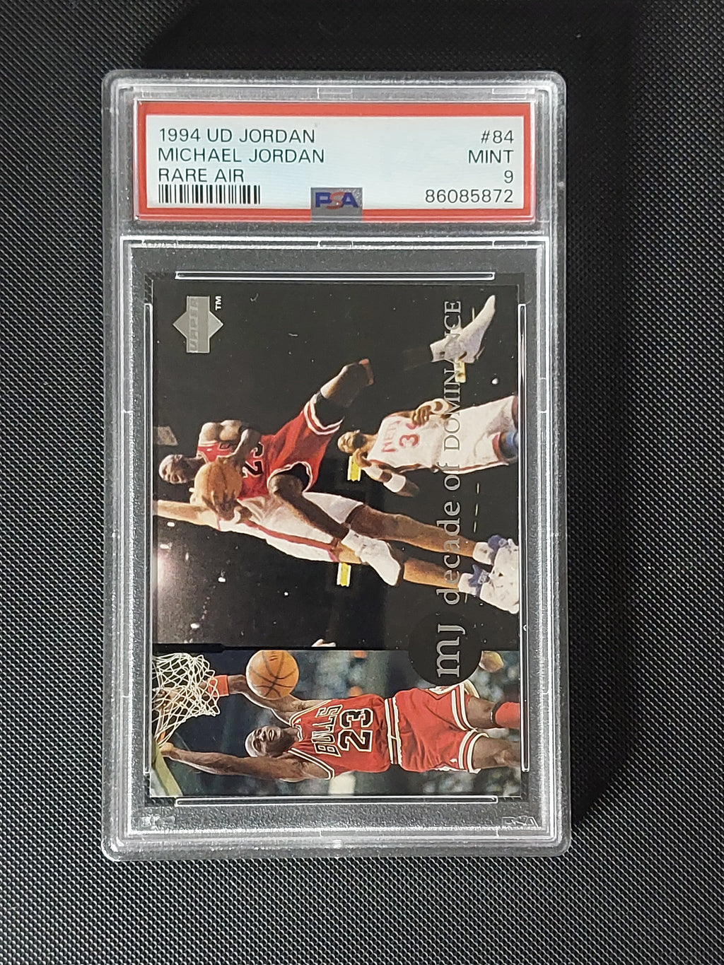 Front of 1994 Upper Deck Michael Jordan Rare Air #84 Decade of Dominance card graded PSA Mint 9