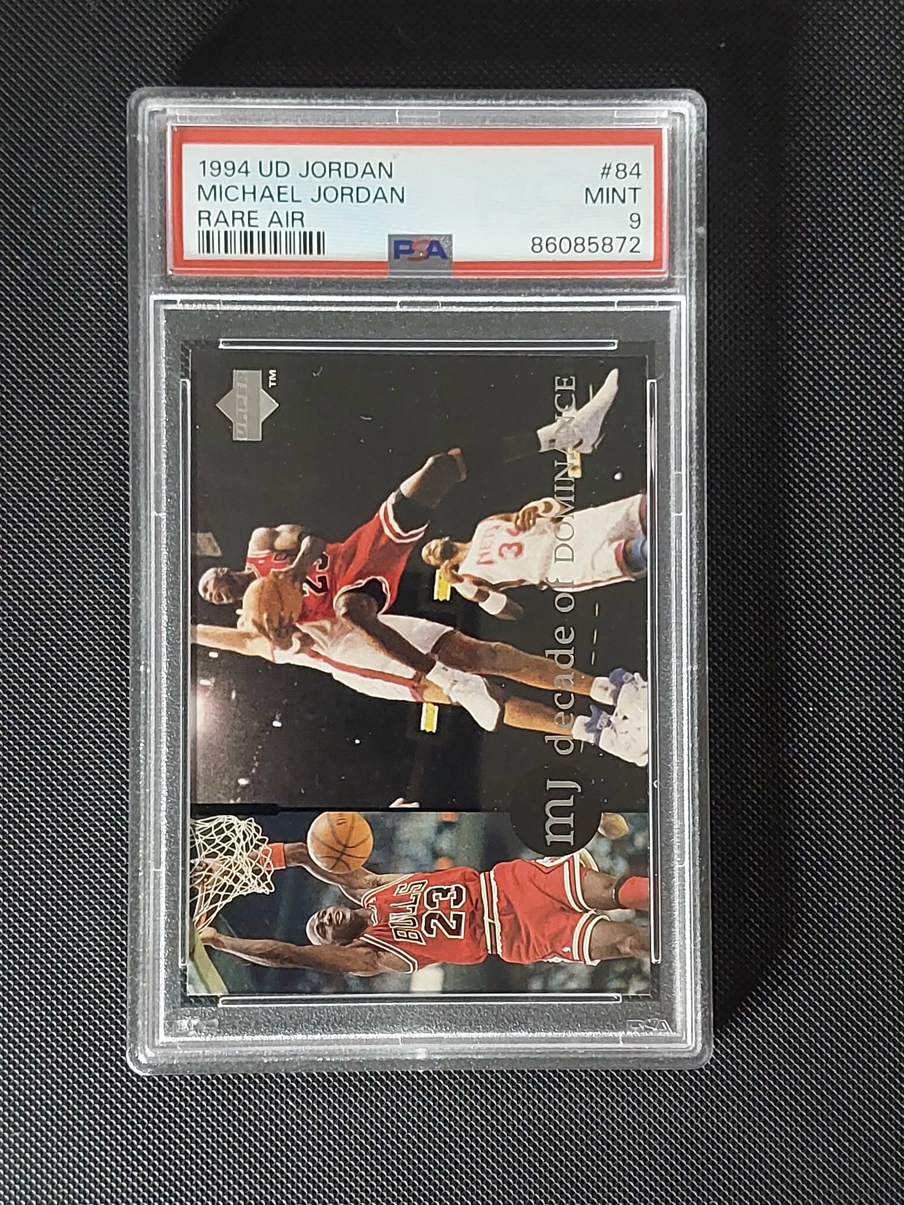 Front of 1994 Upper Deck Michael Jordan Rare Air #84 Decade of Dominance card graded PSA Mint 9