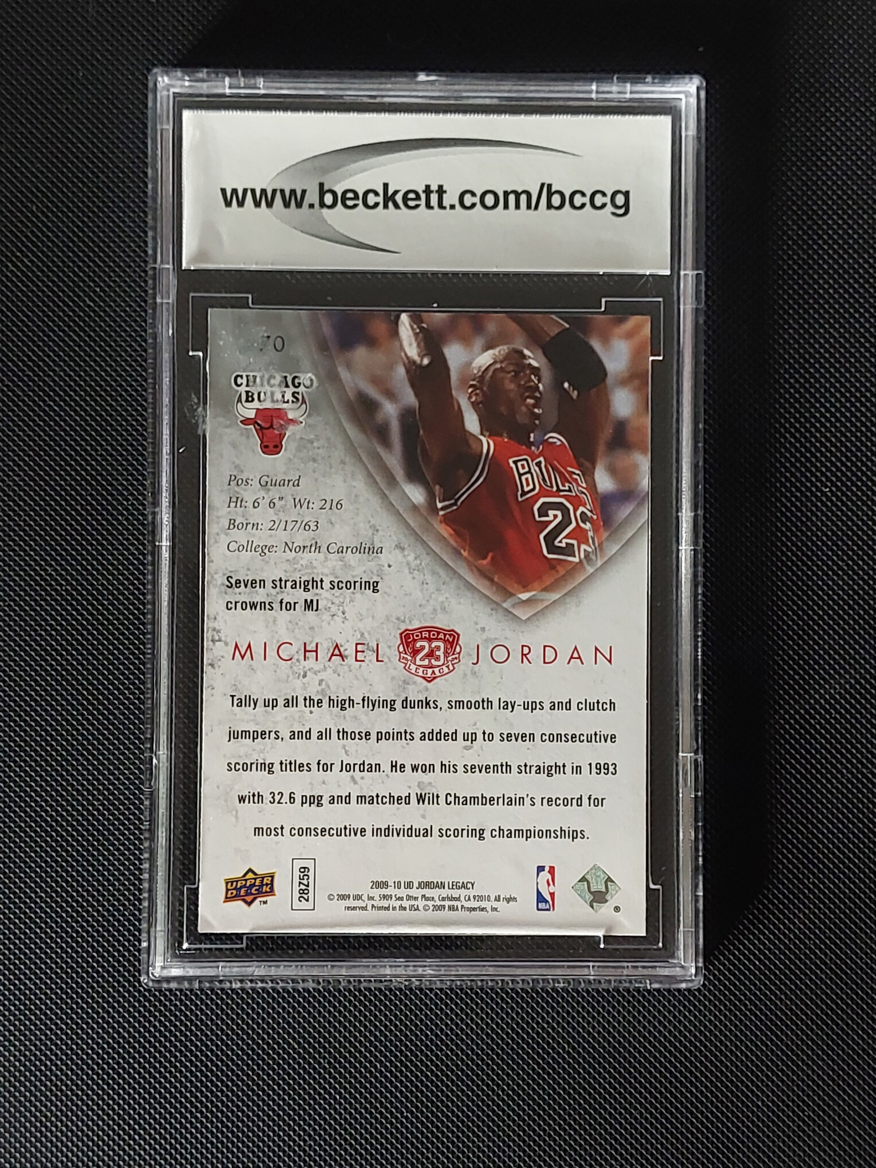 Back of 2009-10 Upper Deck Michael Jordan MJ Legacy Collection Gold #70 BCCG 10 showing Chicago Bulls and seven scoring titles card information.